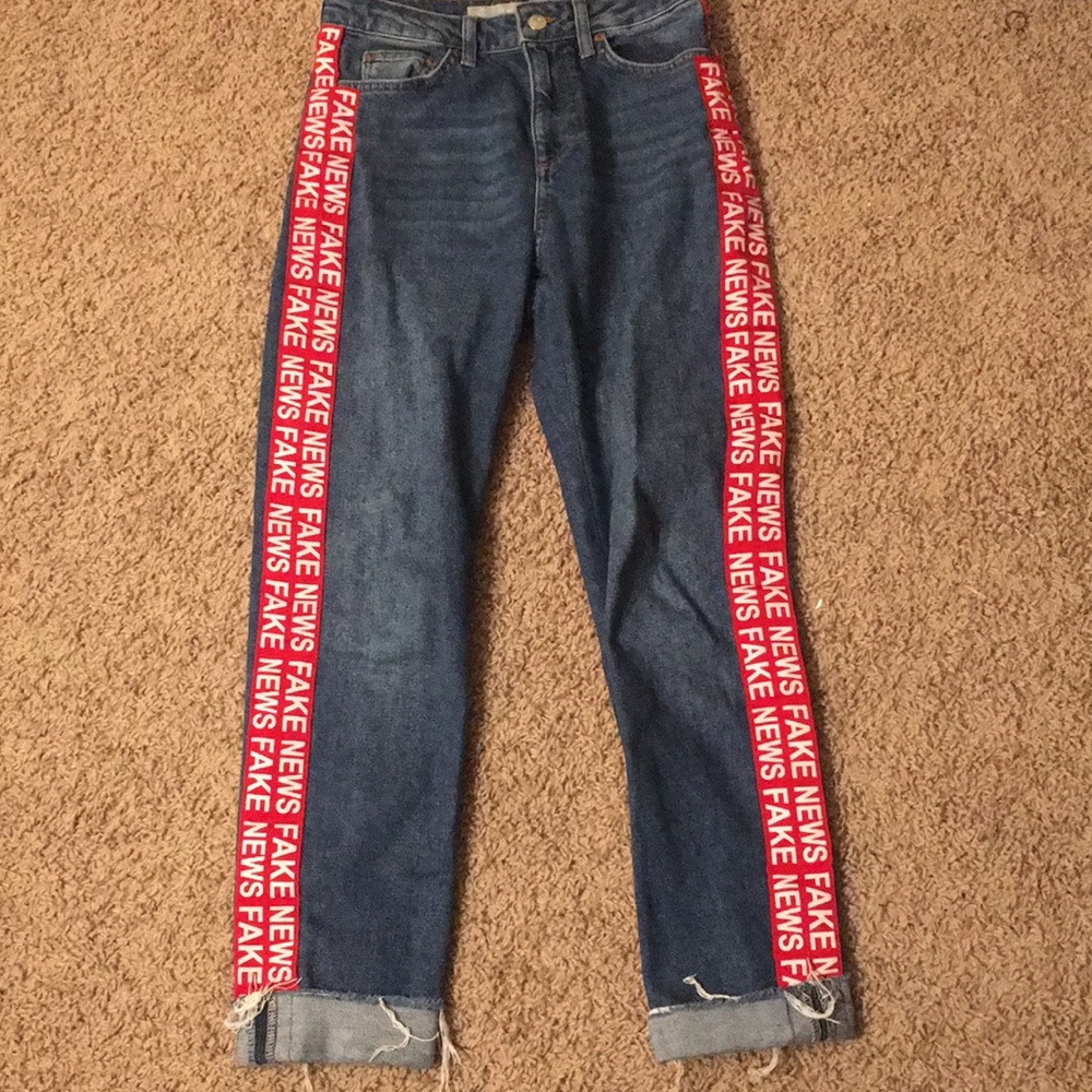 Topshop "fake news" jeans.